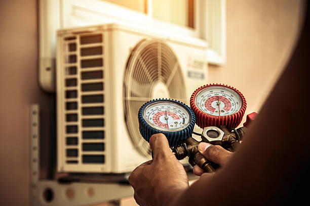 Professional Air Conditioning Service technician working in Redmond, OR